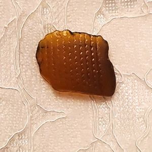 Amber seaglass with lined pattern